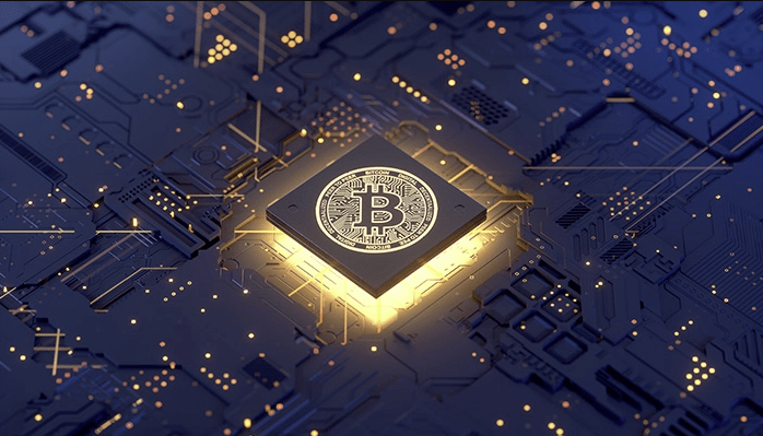 Graphic of a motherboard with a square that is illuminated with light, in the center of that is a bitcoin logo